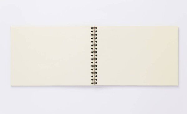 open notebook or book with empty pages on white  background, top view
