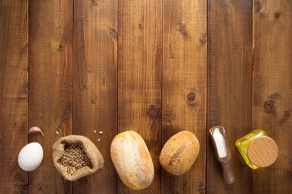 Ingredientes de panadería sobre fondo de madera — Foto de Stock