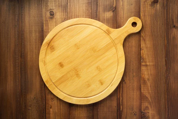 Deska do krojenia na drewniane tła tabeli — Zdjęcie stockowe
