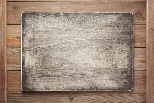 Deska s cedulkou a dřevěná textura — Stock fotografie