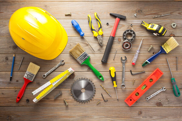 set of tools and instruments at wooden background