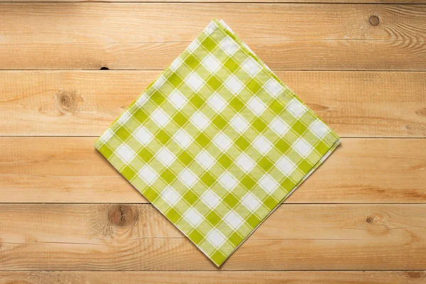 Cloth napkin on at rustic wooden table — Stock Photo, Image