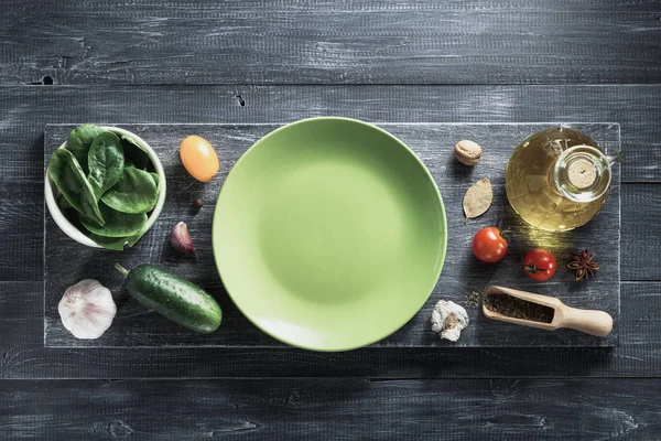 Spice, herbs and food ingredients on wood — Stock Photo, Image