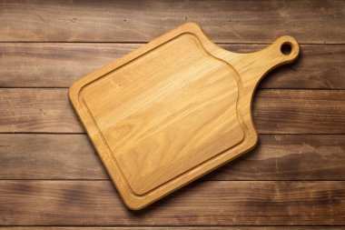 Ahşap tahta tahta arka planda pizza kesme tahtası