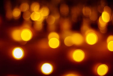 Arka plan beyaz ve turuncu koyu arka plan üzerinde parlak daireler ile