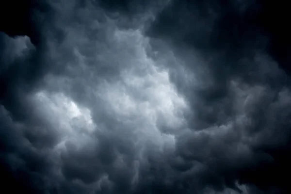 Dark sky with storm clouds, background for design