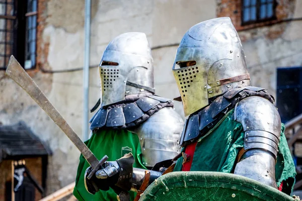 Two armed knights before the fight at the medieval festival