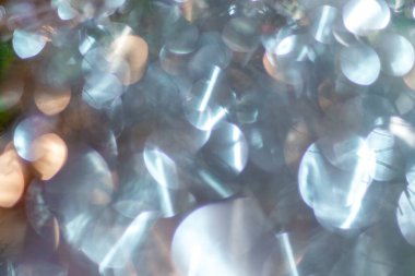 Soyut arkaplan: parlayan bulanık açık mavi daireler