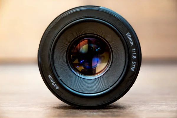 Lens for camera on blurry background. Professional photography equipment