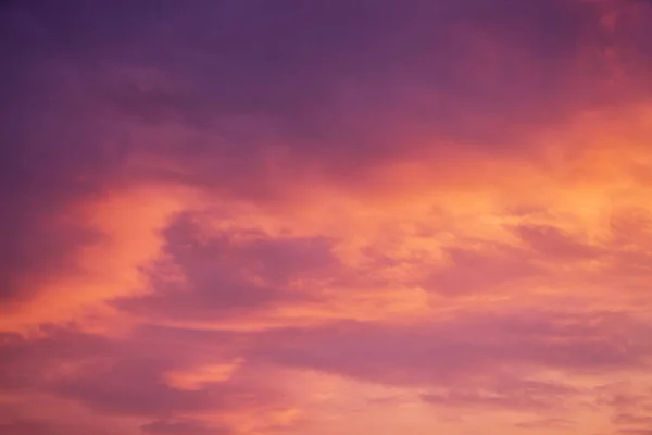 Dark orange and  violet clouds during the sunset