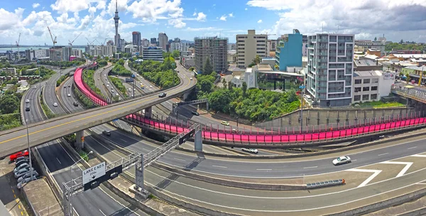 Panoramic urban aerial landscape view of traffic on Auckland city motorway. It is the most populous urban area in New Zealand.