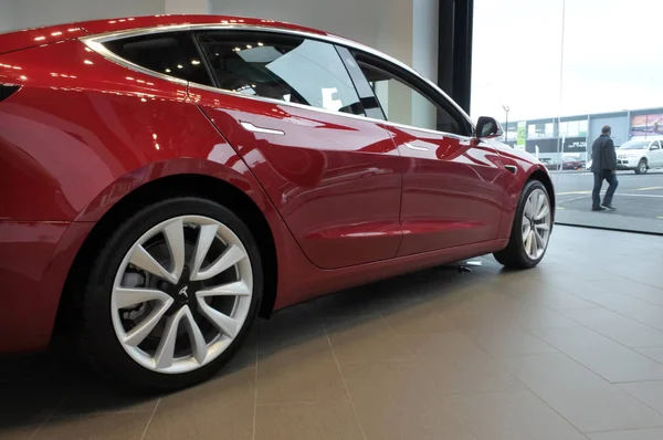 stock image The plug-in electric car Model 3, a mid-size / compact executive luxury four-door sedan manufactured and sold by Tesla, Inc.