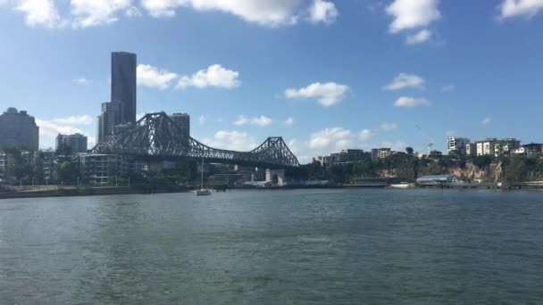 BRISBANE, AUS - DEC 30 2018:Ferry boats sail under The Story Bridge.Its the longest cantilever bridge in Australia, spanning the Brisbane River in Brisbane Queensland, Australia.