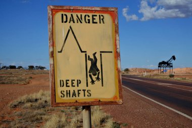 Mine shaft warning sign in Coober Pedy South Australia clipart