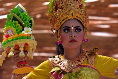 Balinese woman dancing Tari Pendet Dance in Bali Indonesia clipart