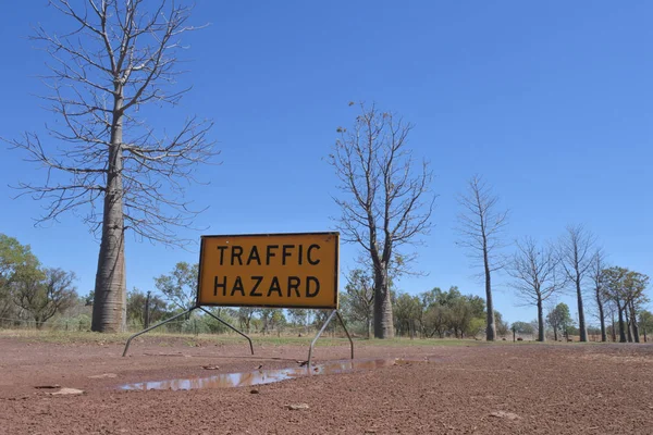 Traffic hazard road sign on a dirt road in Australia — Stock Photo, Image