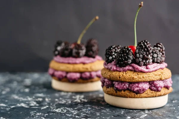 Delicious cookies  with  cream and fresh berries.