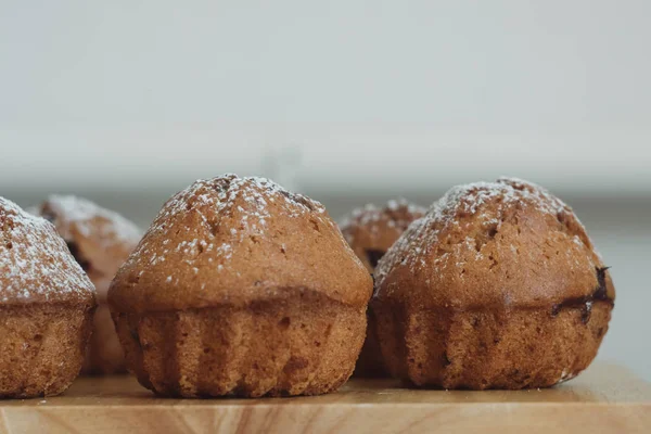 muffin, homemade bakery on wooden background