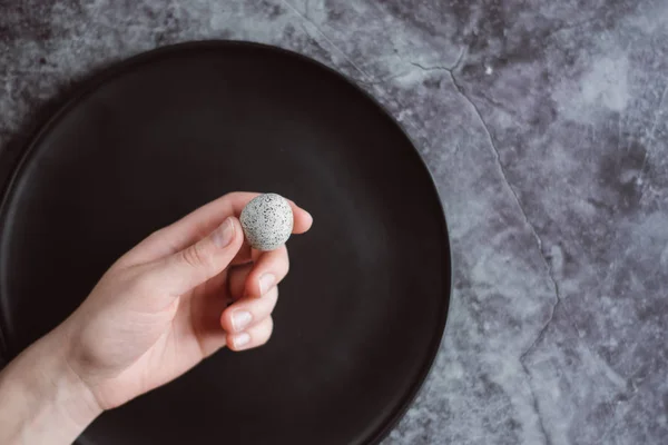 Woman Holding Hands Small Raw Quail Egg Dark Concrete Background — Stock Photo, Image