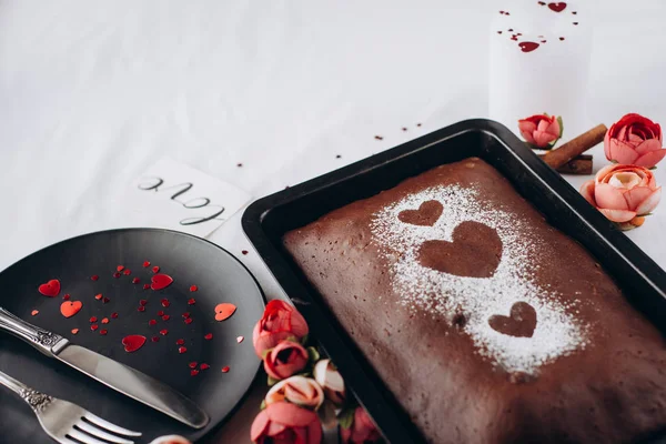 Baked homemade pie, with heart  with dishes on on white background. Healthy homemade whole grain pie. Valentines day   or mother\'s day