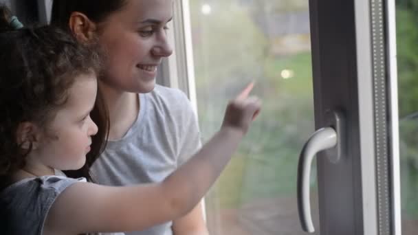 Close Portrait Loving Single Mother Hugs Cute Daughter Window Happy — Stock Video