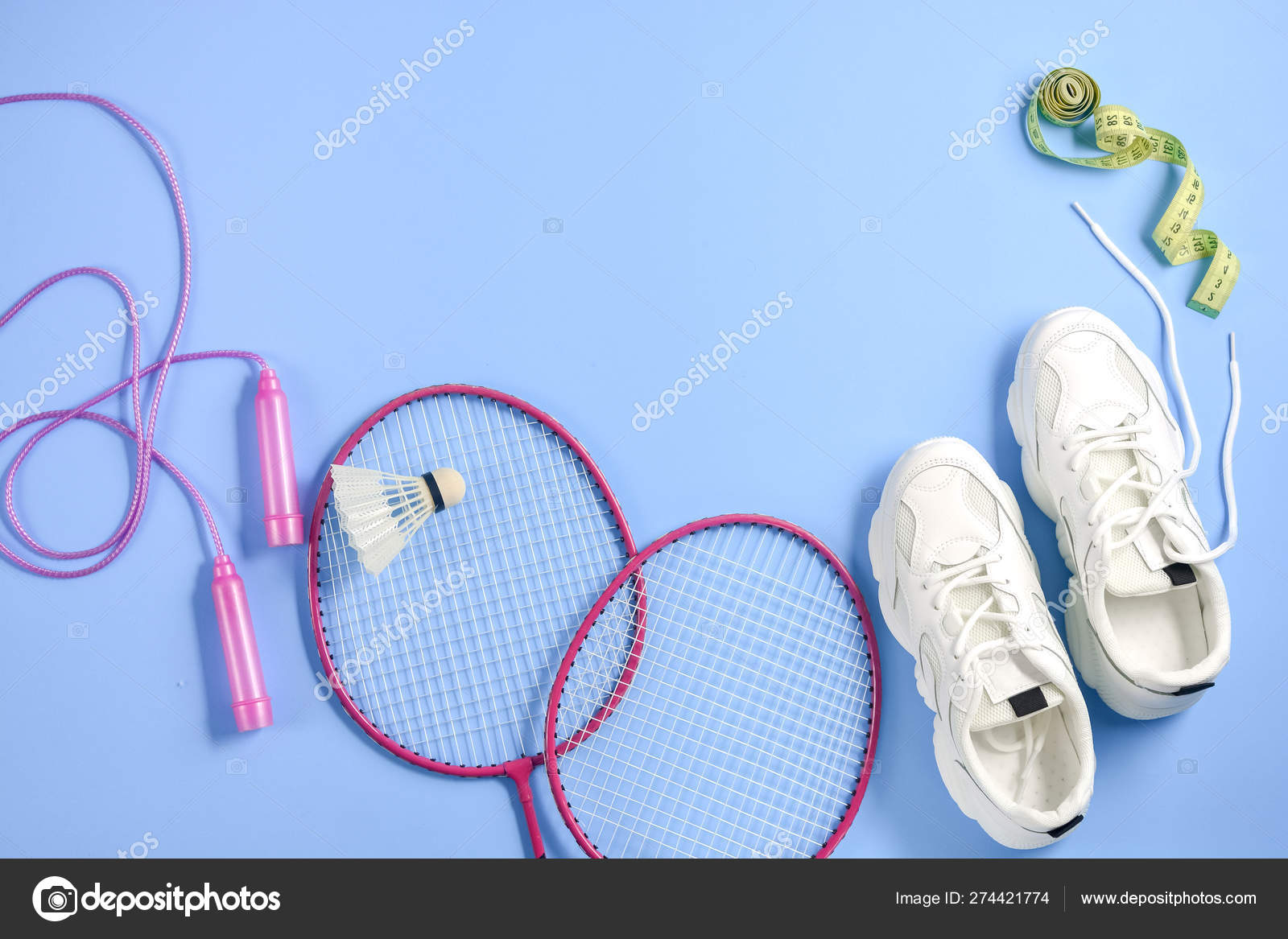 Sports flat lay with shuttlecock and badminton racket, skipping rope,  sneakers and measuring tape on purple background. Fitness, sport and  healthy lifestyle concept. Stock Photo by ©JuraJarema 274421774