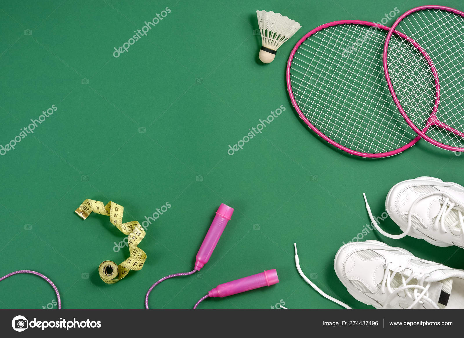 Sports flat lay with shuttlecock and badminton racket, skipping rope,  sneakers and measuring tape on green background. Fitness, sport and healthy  lifestyle concept. Stock Photo by ©JuraJarema 274437496