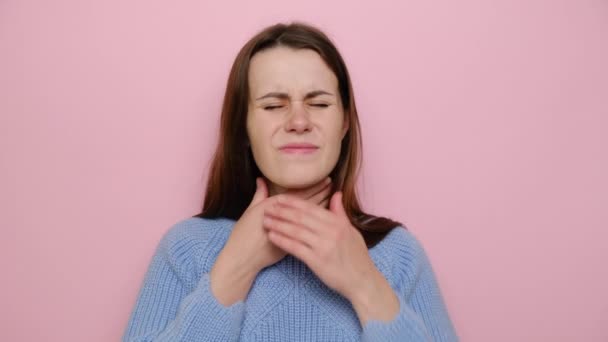 Tired Displeased Young Woman Keeps Hands Neck Stands Pink Background — Stock Video