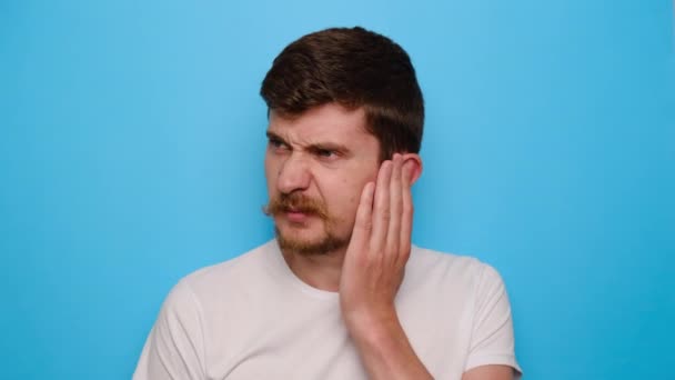 Stressed Frowning Millennial Guy Plugging Ear Feeling Painful Discomfort Avoids — Stock Video