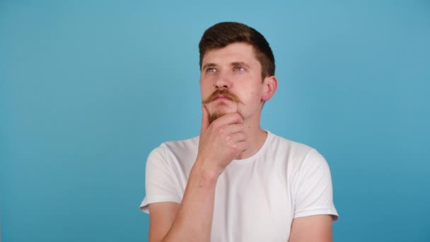 Thoughtful Confused Young Man Touching Chin Scratching Head While Thinking — Stock Video