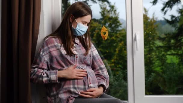 Caring Mother Wearing Medical Face Mask Sitting Windowsill Home Small — Stock Video