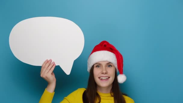 Happy Young Woman Holding Pointing Blank Speech Bubble Dressed Christmas — Stock Video