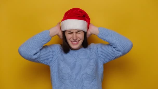 Irritated Young Woman Christmas Hat Covering Ears Gesturing Avoiding Advice — Stock Video