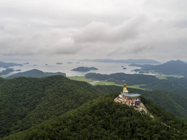 The Medicine Buddha on the mountain peak