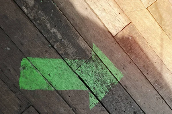 Green Arrow Wooden Floor Empty Copy Space Text — стоковое фото