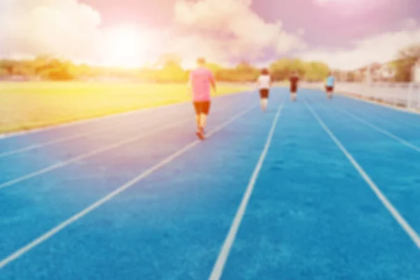 Blurred background ,Sports arena for outdoor exercise. There are many people running on good days and bright sky.