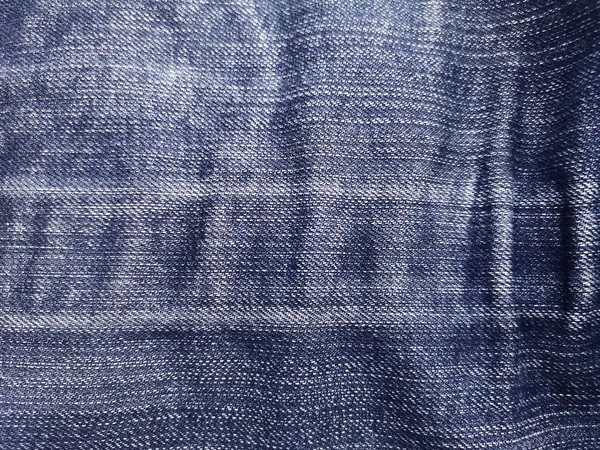 Textura de vaquero azul denim viejo abstracto, superficie de primer plano hasta el fondo de fibra . — Foto de Stock