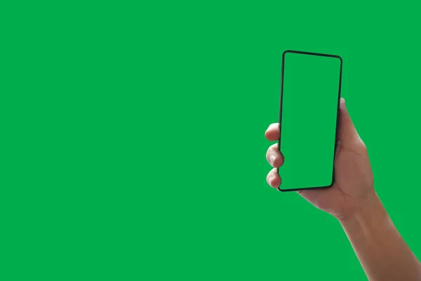 Top View holding hand smartphone with green screen Isolated on background with clipping path .