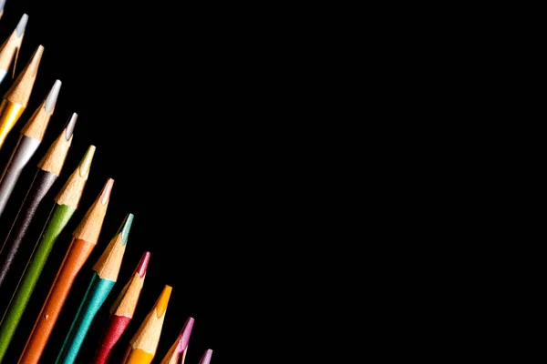 Set beautiful black, colored pencils of colored pencils on black background. Soon to school. Back to School