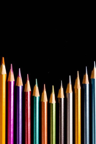 Set beautiful black, colored pencils of colored pencils on black background. Soon to school. Back to School