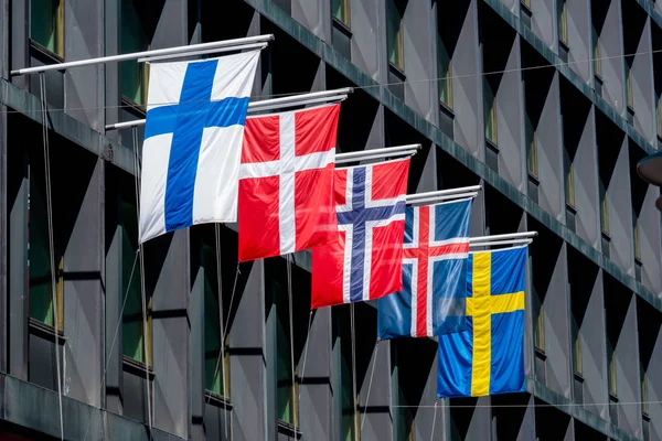 Five Nordic flags on flagpoles with EU flag. Denmark, Sweden, Norway, Finland, Iceland — Stock Photo, Image