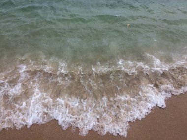 kum ve dalga plaj arka plan üzerinde