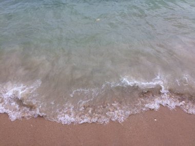 kum ve dalga plaj arka plan üzerinde