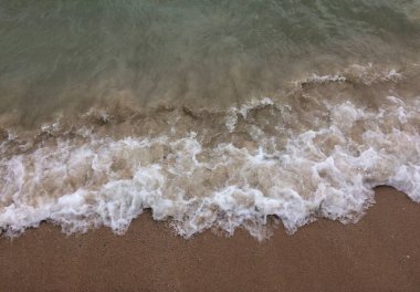 kum ve dalga plaj arka plan üzerinde