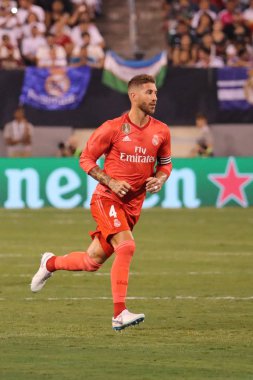 EAST RUTHERFORD, NJ - AUGUST 7, 2018: Captain and centre back Sergio Ramos of Real Madrid #4 in action during the 2018 International Champions Cup match against Roma at MetLife stadium.  clipart
