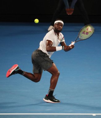 Melbourne, Avustralya - 22 Ocak 2019: Profesyonel tenis oyuncusu Frances Tiafoe Amerika Birleşik Devletleri Rafael Nadal 2019 Avustralya Açık Melbourne karşı onun çeyrek final maçı sırasında eylem 