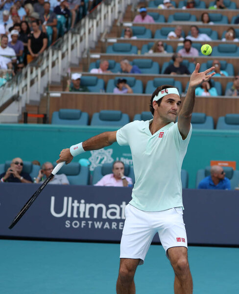 MIAMI GARDENS, FLORIDA - MARCH 27, 2019: Grand Slam champion Roger Federer of Switzerland in action during his round of 16 match at 2019 Miami Open at the Hard Rock Stadium in Miami Gardens, Florida