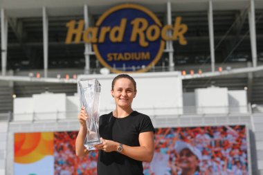 MIAMI GARDENS, FLORIDA - MARCH 30, 2019: Professional tennis player Ashleigh Barty of Australia posing with trophy after her win at 2019 Miami Open final match at the Hard Rock Stadium in Miami Gardens clipart