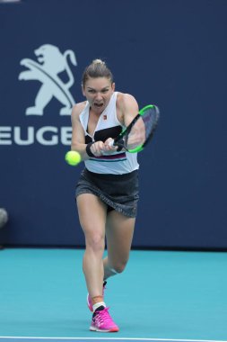 MIAMI GARDENS, FLORIDA - MARCH 27, 2019: Grand Slam Champion Simona Halep of Romania in action during her quarter-final match at 2019 Miami Open at the Hard Rock Stadium in Miami Gardens, Florida