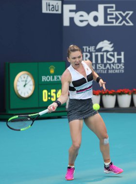 MIAMI GARDENS, FLORIDA - MARCH 27, 2019: Grand Slam Champion Simona Halep of Romania in action during her quarter-final match at 2019 Miami Open at the Hard Rock Stadium in Miami Gardens, Florida